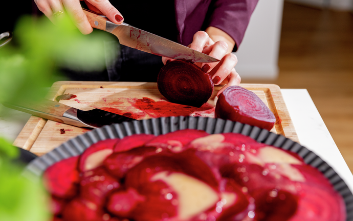 Woman slices beet