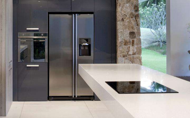 Modern kitchen with a range of appliances looking out onto a garden