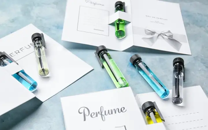 Perfume samples on color background