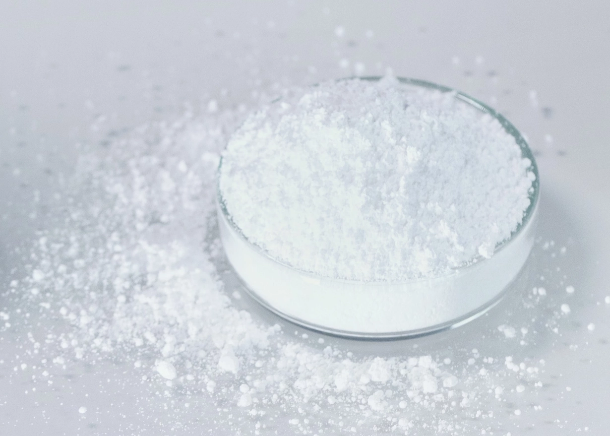 White glass powder, as fine as baby powder, in a Petri dish.