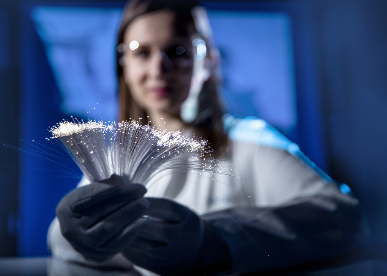 Engineer holds a flexible light guide used in minimally invasive surgery