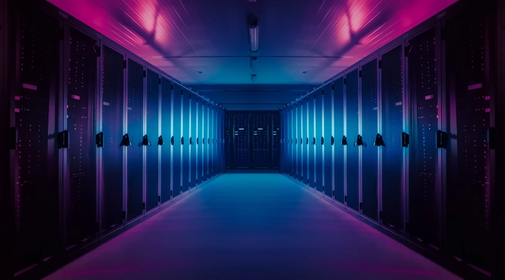 Row of high performance computers bathed in purple light