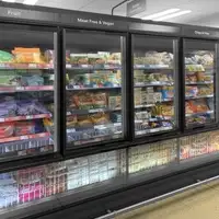 A row of supermarket freezers featuring SCHOTT Termofrost® Twinline glass door systems