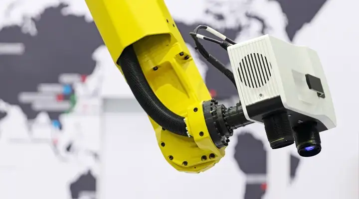 Yellow robot arm with camera attached