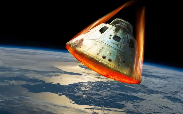 A space capsule returning to Earth.